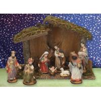Crèche de Noël : cabane + 11 personnages de 12 cm ( x 10 x 20 cm)