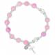 Bracelet sur élastique Rose + Médaille + Croix