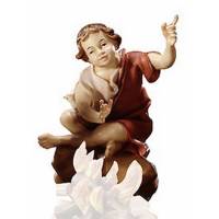 Enfant assis devant le feu : crèche de Noël en bois Ulrich 15 cm